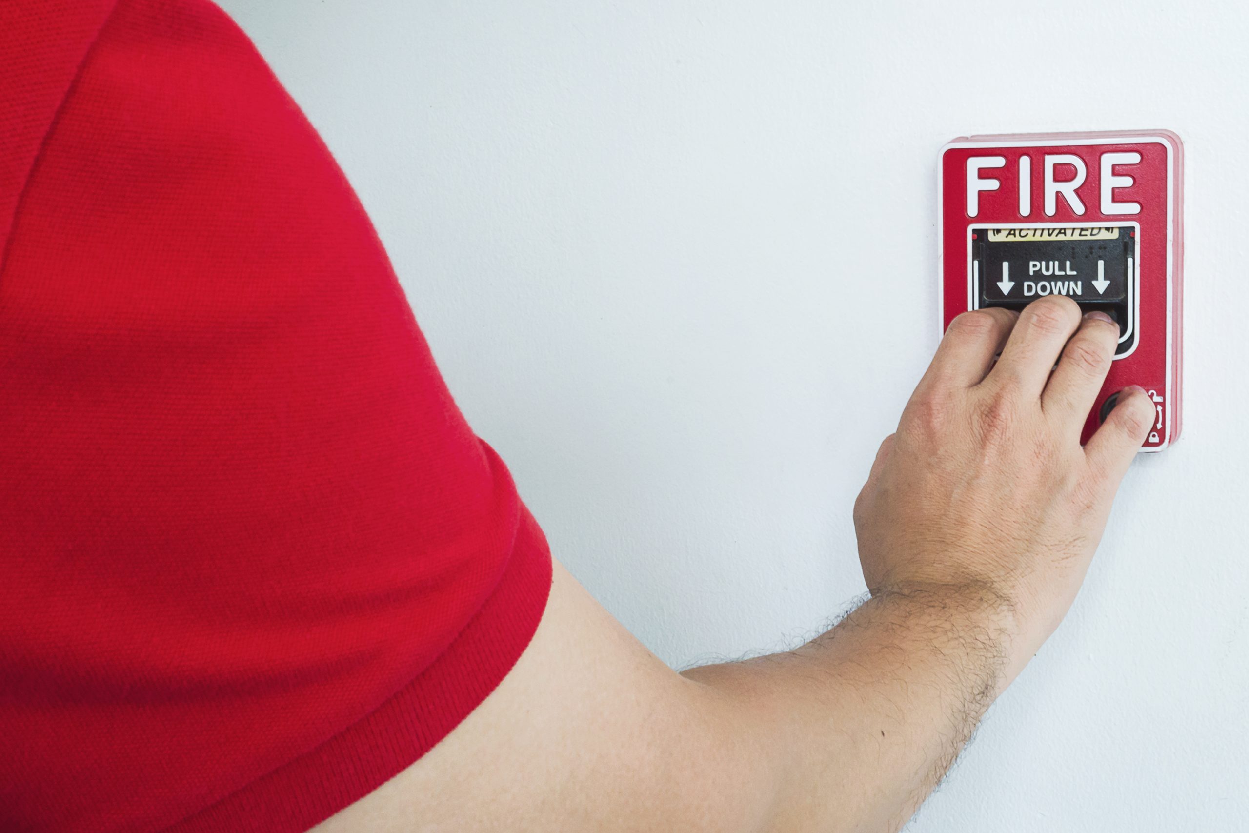 2025 11 29T22:29:33.300984Z man is reaching his hand to push fire alarm hand station free photo 2025 11 29T22:29:33.300984Z man is reaching his hand to push fire alarm hand station free photo